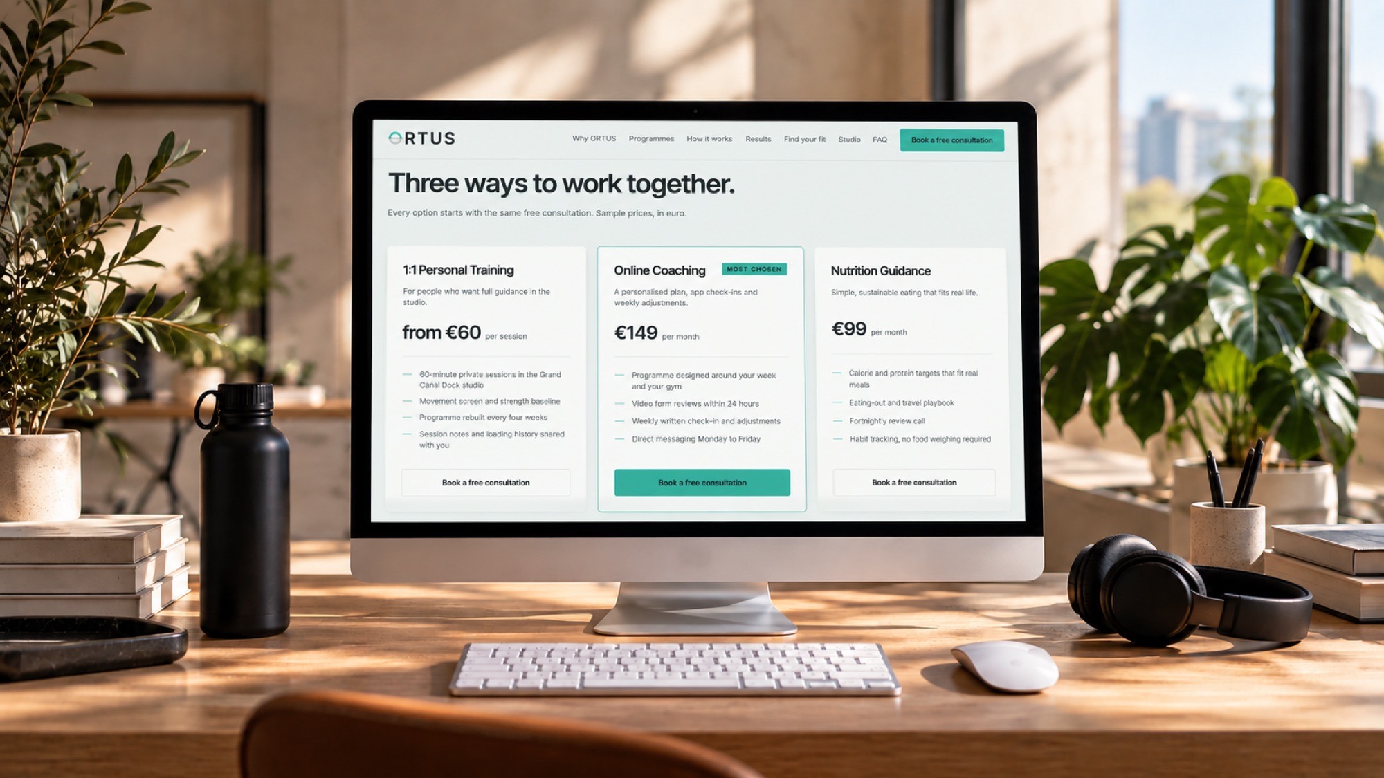 The ORTUS booking page open on an iMac in a bright studio