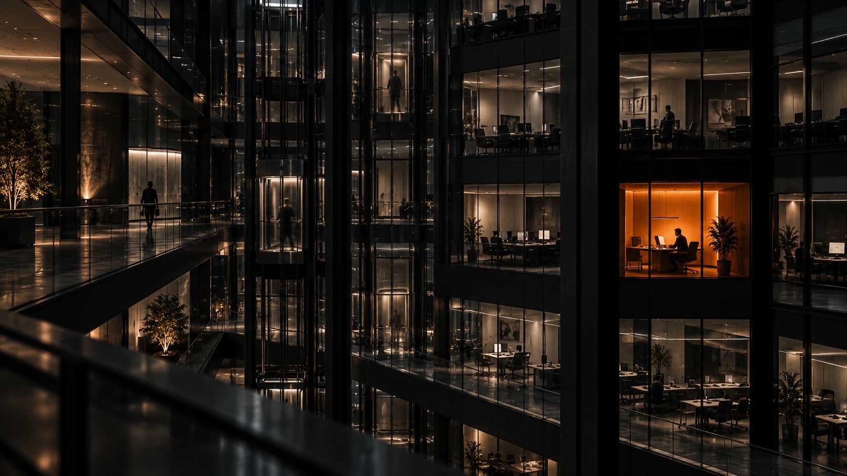 A dark glass office building at night, one window glowing orange